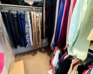 many clothes, pants, women`s clothing 