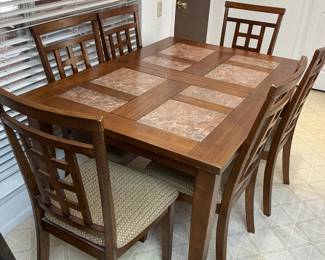 Lovely table & 6 chairs, top of table (58x40), table 30 inches tall, chairs (18x40), includes leave