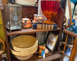 Vintage pottery bowls, old books and gorgeous vases and kitchen ware