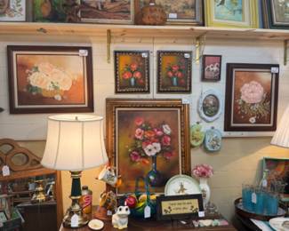 Many gorgeous oil paintings, lots of colorful decor and a vintage cabinet