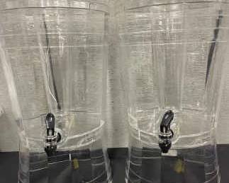 Two Clear Plastic Beverage Dispensers