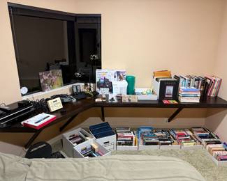 Novels, coffee table books, electronics, office supplies, DVD player, Karaoke machine, Wi-Fi router more to list