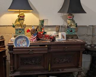 Victorian sideboard with marble tops and griffin doors, fu dog lamps