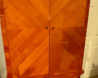 Glossed teak wardrobe from an Italian retailer