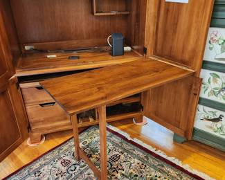 armoire/TV cabinet by Ethan Allen. has a drop-down desk top and pullout desk. Solid wood