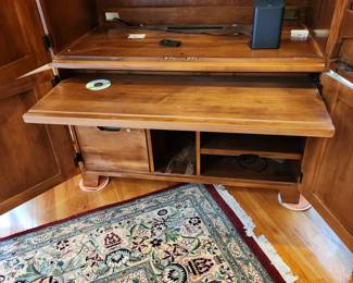 armoire/TV cabinet by Ethan Allen. has a drop-down desk top and pullout desk. Solid wood