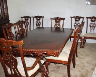 10' dining table and ten chairs (6' as shown, plus two 24" leaves)