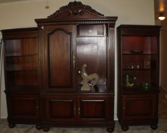 three-piece entertainment center; pieces separate and can stand alone