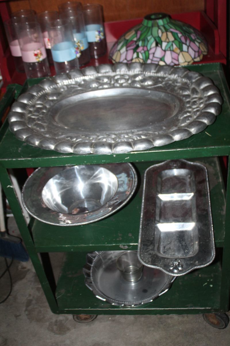 lots of heavy aluminum and Armetale platters, bowls, serving pieces