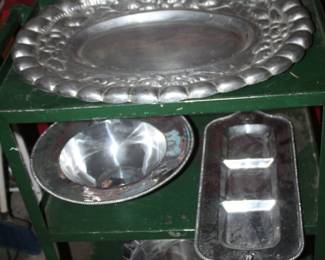 lots of heavy aluminum and Armetale platters, bowls, serving pieces