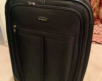 Large almost new Samsonite rolling luggage. 