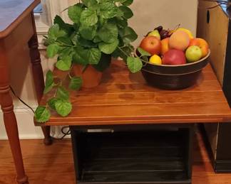 Wood side table black base. Great storage. 