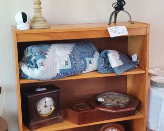 Wood shelf for sale.
Hand stitched quilt.
Antique Clocks.