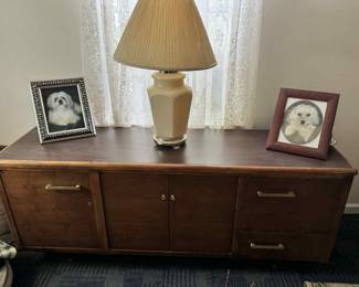 Solid wood console table with lots of storage. Great condition.