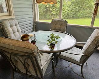 Outside table with cushions and chairs