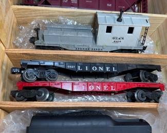 postwar lionel locomotives flat cars box, cars, and caboose, and Tie jecter car 