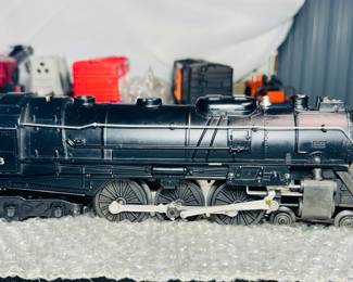 postwar lionel locomotives flat cars box, cars, and caboose, and Tie jecter car 