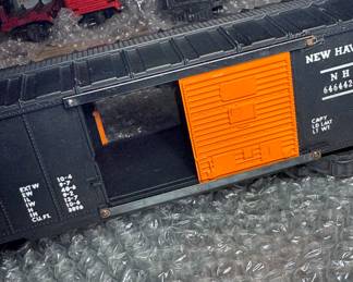 postwar lionel locomotives flat cars box, cars, and caboose, and Tie jecter car 