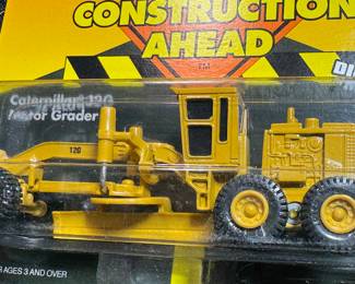 die cast construction trucks new in package from ERTL. 