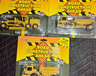 die cast construction trucks new in package from ERTL. 