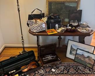 Floor Lamp, Persian Style Rug, Wood Table, Wall Art, Purses, Wall Art, Violin 