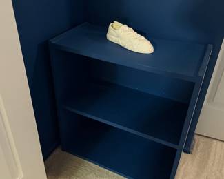 corner bookshelf, navy blue shelf, painted wood furniture, small bookcase, storage shelf, home décor furniture.