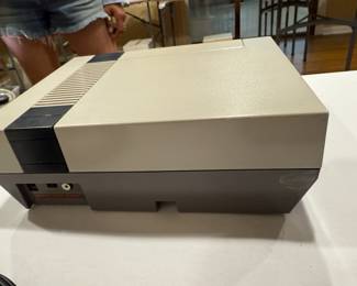 Nintendo NES console, vintage video game system, retro electronics, collectible gaming, 1980s Nintendo.
