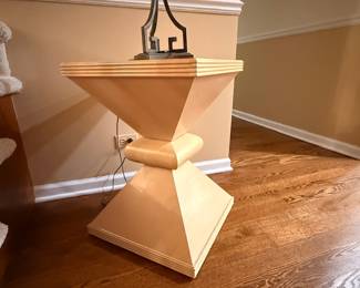 postmodern side table, vintage pedestal stand, Memphis design style, 1980s geometric furniture, art deco revival table, sculptural end table.
