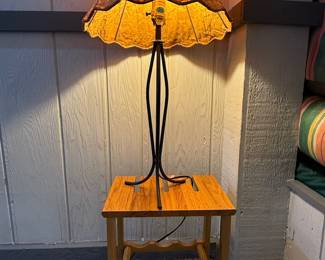 Vintage Accent Lamp w/ Side Table & Wine Rack Base
Unique combo piece featuring a warm amber-shaded accent lamp atop a compact wooden side table with built-in wine rack storage. Perfect for cozy living rooms, dens, or entertainment spaces. Functional and stylish lighting with storage.