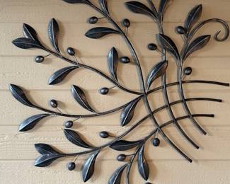 metal wall art, wrought iron wall sculpture, leaf and vine wall decor, decorative wall hanging, garden art, rustic wall accent.
