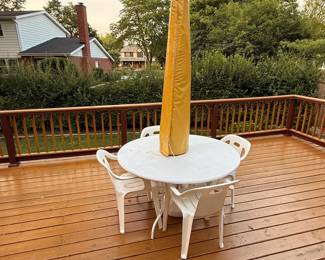 patio dining set, outdoor furniture, backyard table with umbrella, deck chairs, garden dining set, outdoor entertaining furniture.
