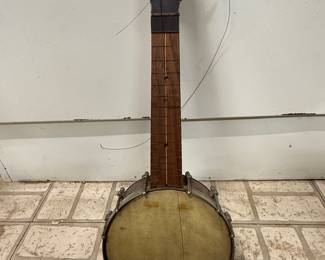 vintage banjo, antique musical instrument, 4-string tenor banjo, restoration project, folk music collectible.
