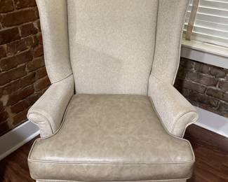 Pair of Wing Back chairs located in entry with a vinyl covered seat (Located in Entry)