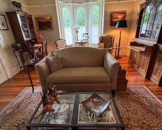 Small sofa, great for a study /office.  2 glass tables that could serve as a coffee table or end tables. 
