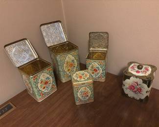 Set of 4 metal canisters that fit together
Single metal canister
