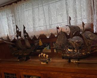 Carved wooden ships
Small ship is carved from some kind of horn or bone
Amazing detail