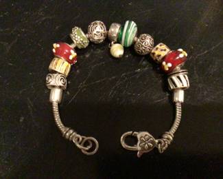 PANDORA bracelet with 12 beads (4 Morano glass,4 enamel painted) $800. 