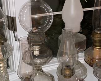 Collection Of Antique Oil Lamps In Varying Sizes