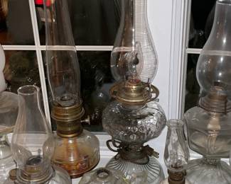 Collection Of Antique Oil Lamps In Varying Sizes
