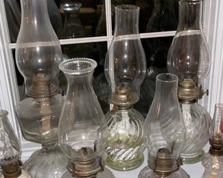 Collection Of Antique Oil Lamps In Varying Sizes