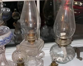 Collection Of Antique Oil Lamps In Varying Sizes