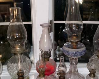 Collection Of Antique Oil Lamps In Varying Sizes