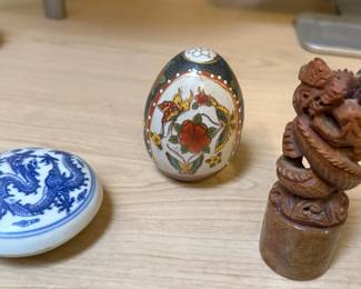 These are wonderful collectibles from Asia. The egg is a Satsuma egg; the blue piece with dragon is an ink pot; and the carved piece is a stamp.