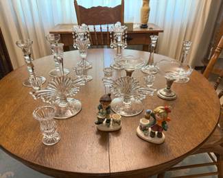 There are a variety of lovely glass and porcelain candleholders and a pair of lusters
