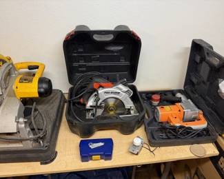 From left to right we have a DeWalt Chop Saw; a Black & Decker Fire Storm saw with laser; and a Chicago Tools 1" SDS Rotary Hammer.