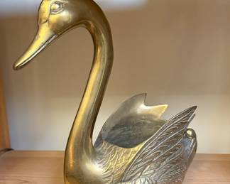 This is a midcentury brass swan.