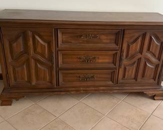 This is a lovely buffet with plenty of space for china and Knick knacks as well as silverware and table linens.