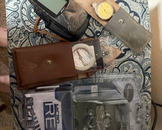 Here is more hunting paraphernalia. Note the vintage compass and the Micro Red Outdoor camera.