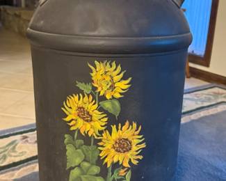 This is a classic milk can painted with sunflowers.