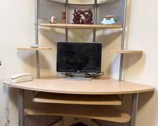 This is a handy space saver for your computer desk. It fits in a corner and has ample storage shelving.